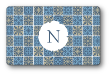Nunzio logo over blue quilt pattern background